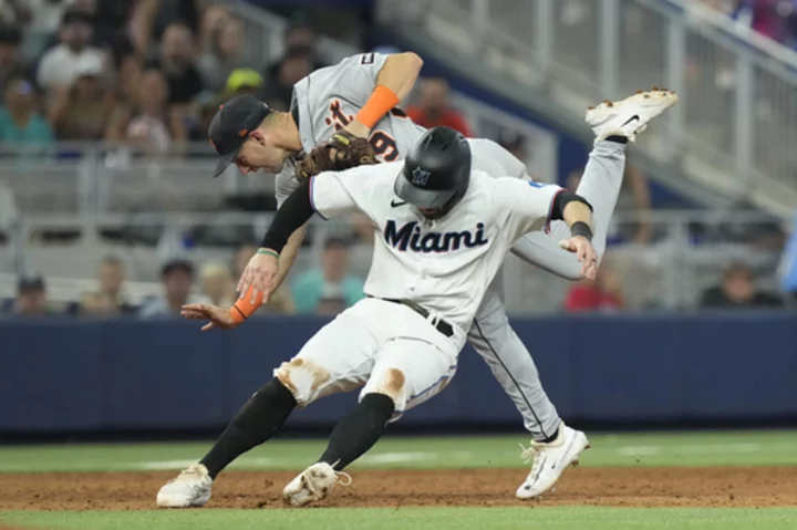 Cooper and Segura homer, López and Robertson play key roles as Marlins beat Tigers 8-6