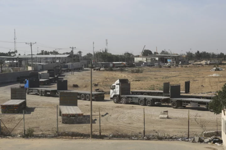 Egypt border crossing opens, letting a trickle of desperately needed aid into besieged Gaza