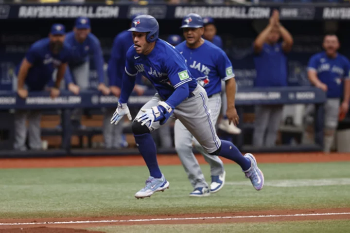 Springe'r's inside-the-park homer, diving catch and throw lead Blue Jays over Rays 9-5