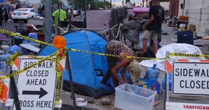 'It's inhumane to stop them': Outrage as volunteers claim city of Phoenix and police cordoned off homeless encampment on Thanksgiving Day