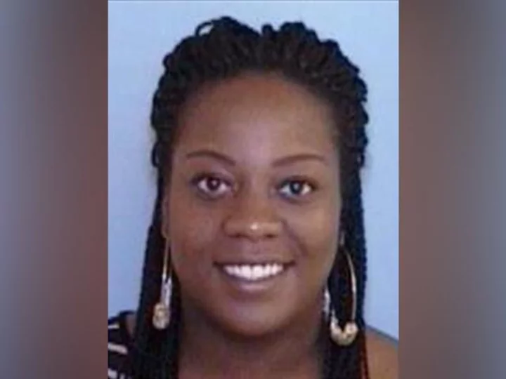 A missing North Carolina woman has been found dead, and a man found in her SUV has been arrested, police say