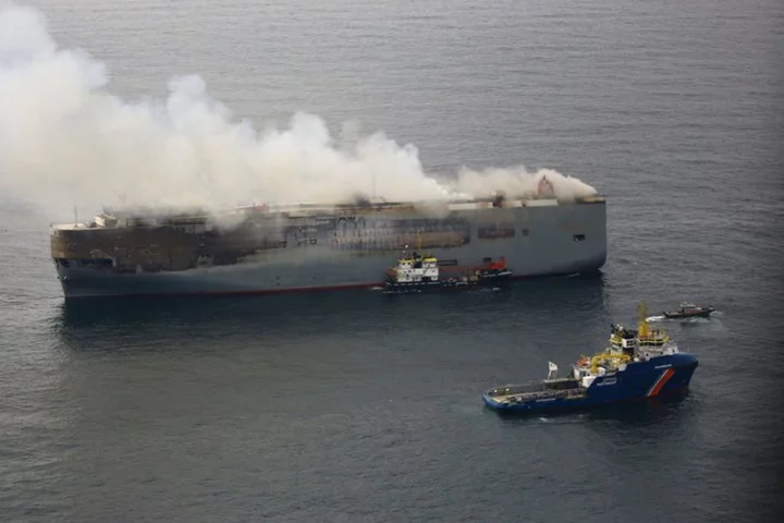 Burning car carrier towed to temporary location off Dutch coast