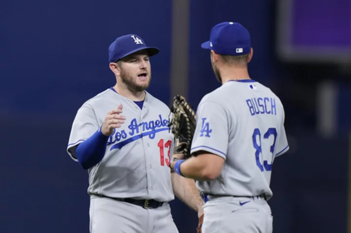 Dodgers credited with a run when Marlins ball boy picks up a ball that was in play