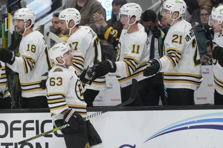 Bruins beat the winless Sharks 3-1 for their 3rd straight win to open the season