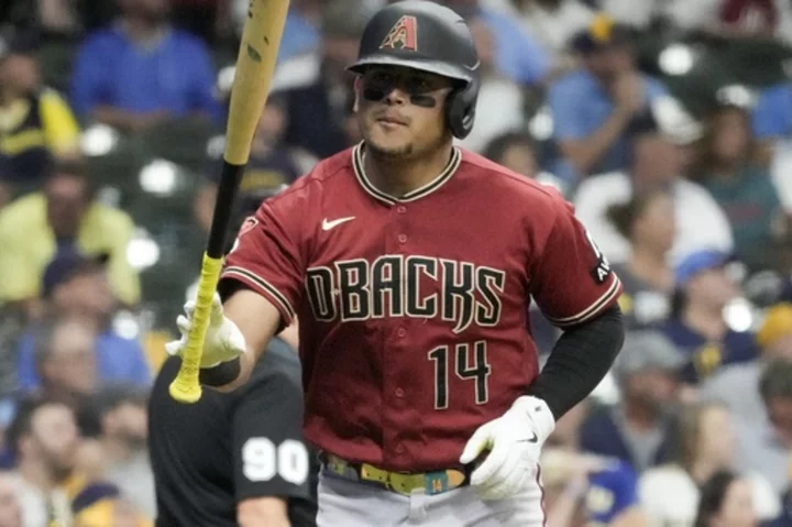 Arizona catcher Gabriel Moreno leaves Game 2 of Wild Card Series after backswing hits his helmet