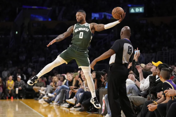 Lillard scores 14 points in Milwaukee debut as Bucks beat Lakers