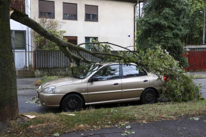 A child and a woman die in Serbia as a second deadly storm rips through the Balkans this week